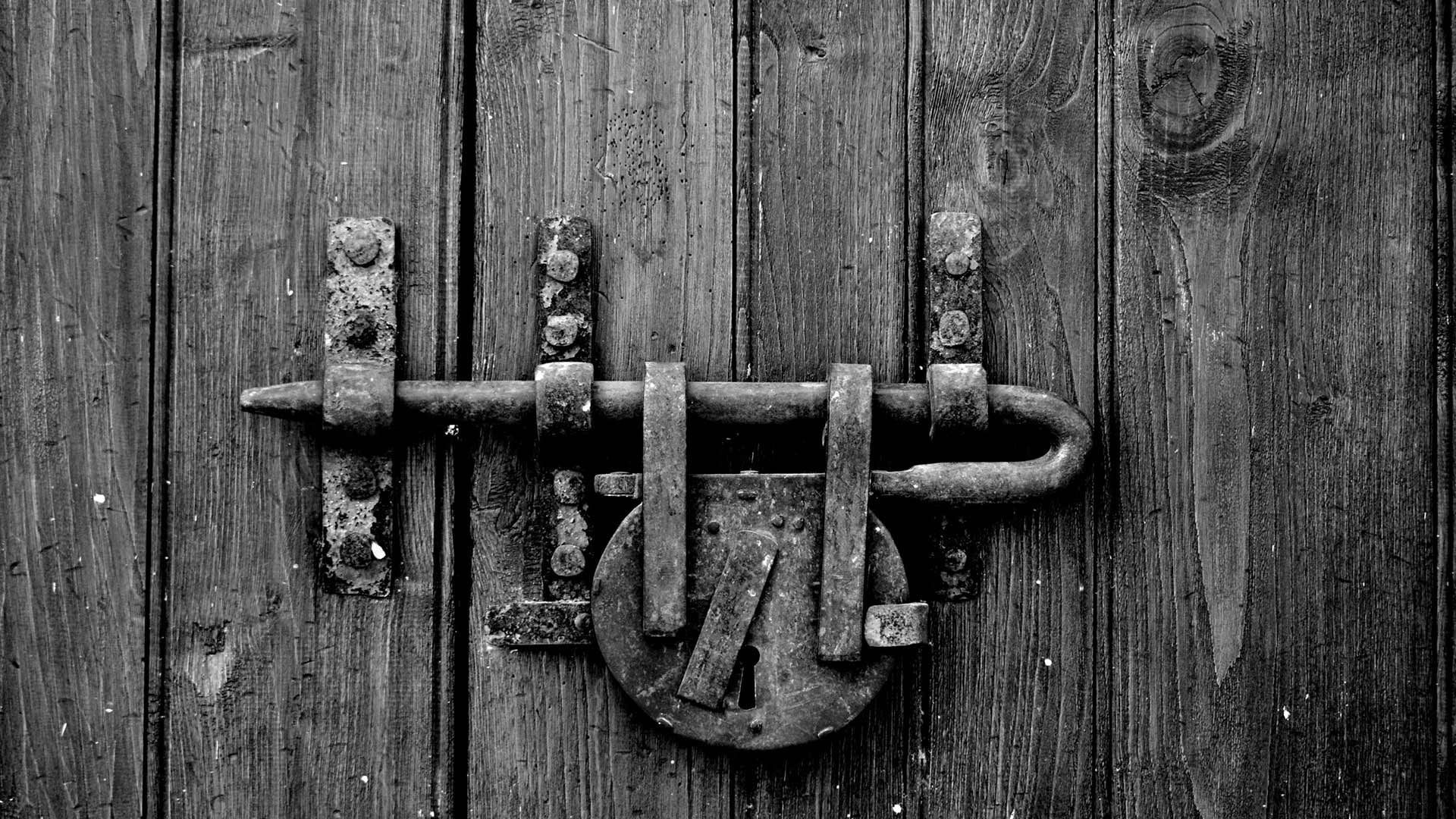 Aged wooden door with rustic lock