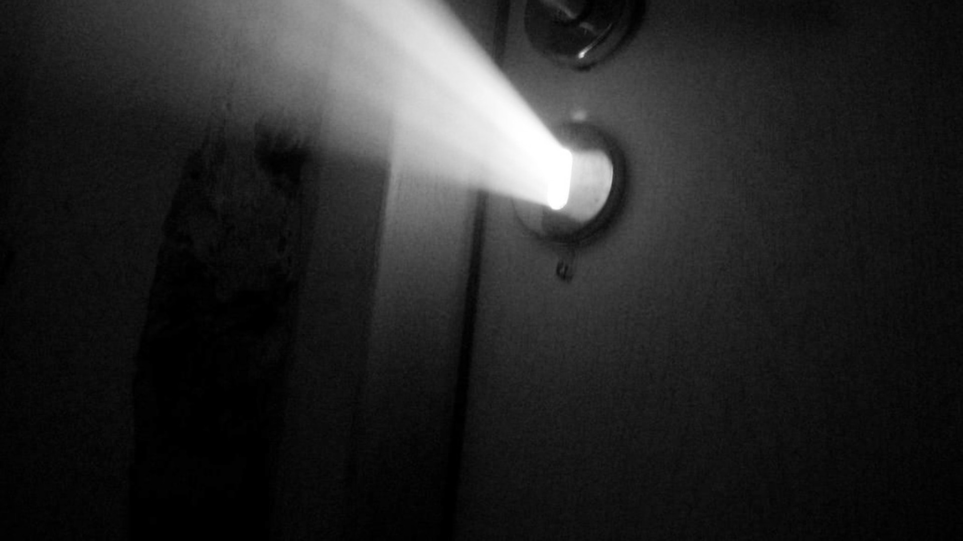 Wall-mounted light fixture glowing bright